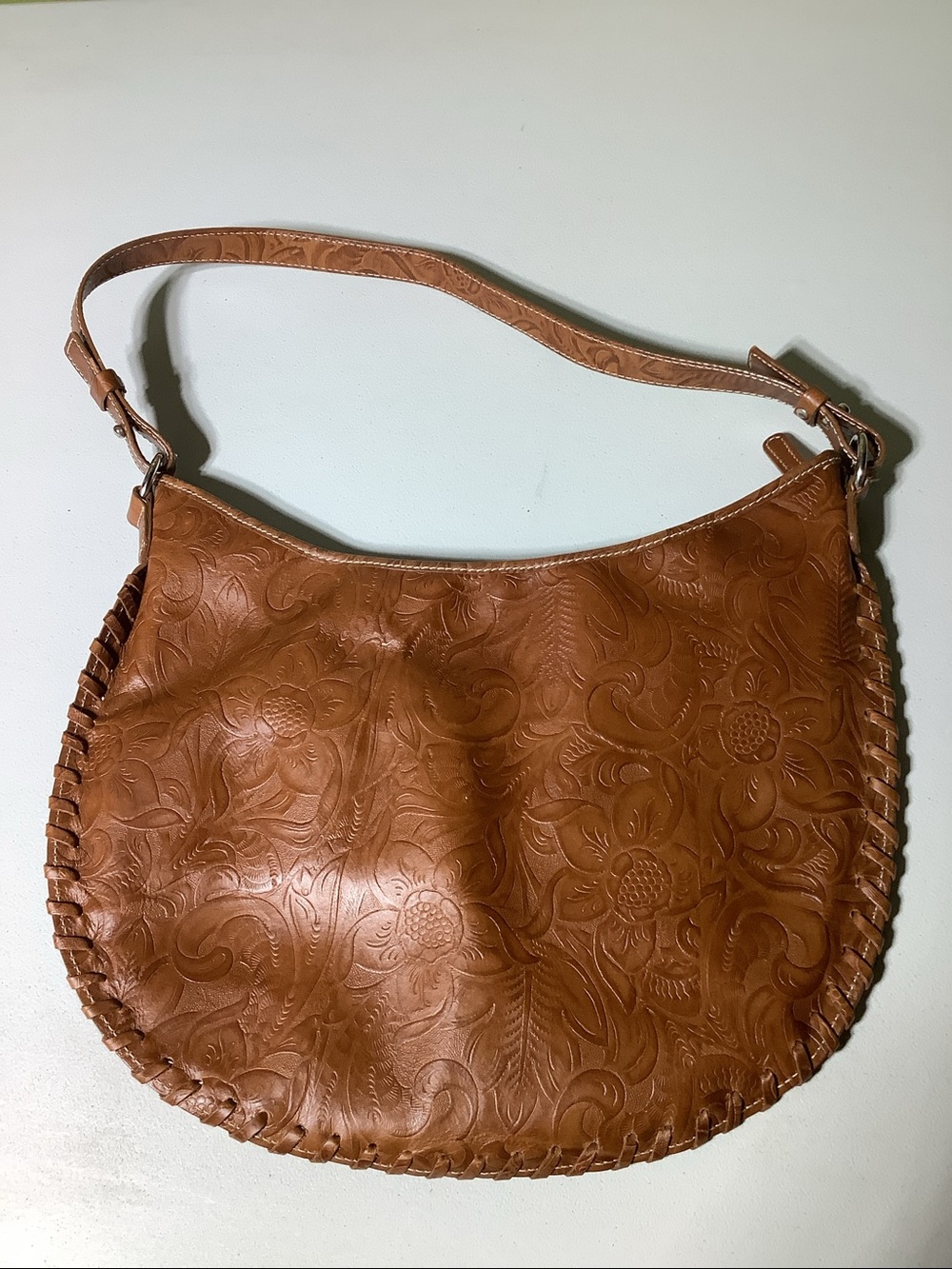 Harold’s leather tooled purse